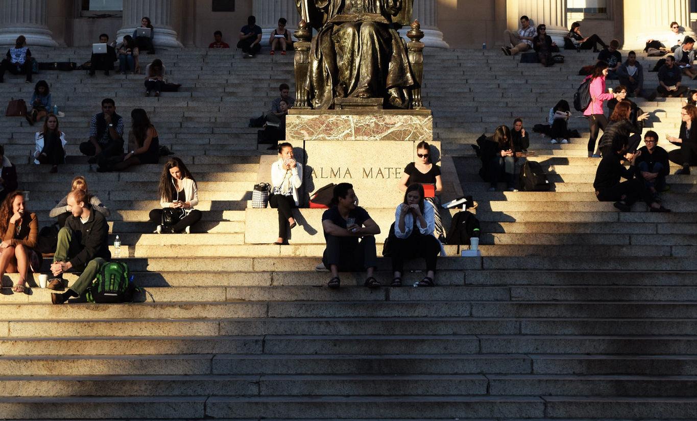 Students sitting at Low Library steps
